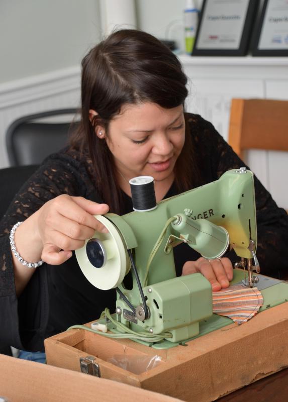 Mary Lemire, who works at the Cape Gazette, sews masks for fellow workers. Face masks will be required in public places starting April 28. RON MACARTHUR PHOTO